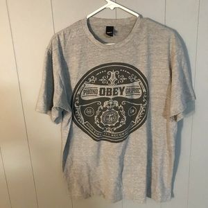 Obey T-shirt with vinyl record themed logo.